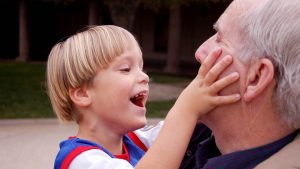 Happy special needs child with grandfather - Special Needs Planning Oakdale MN