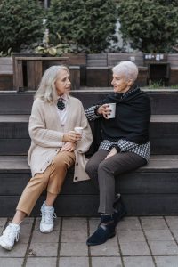 taxes on inheritances, image of two older women chatting outdoors