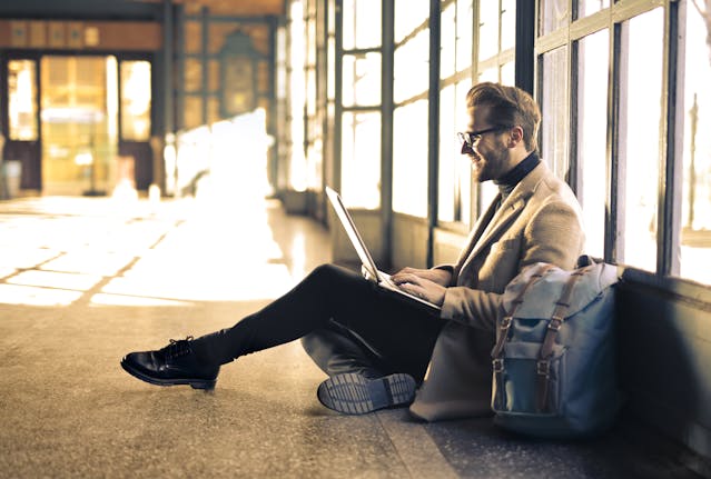 estate planning for cryptocurrency, image of businessman in airport reading